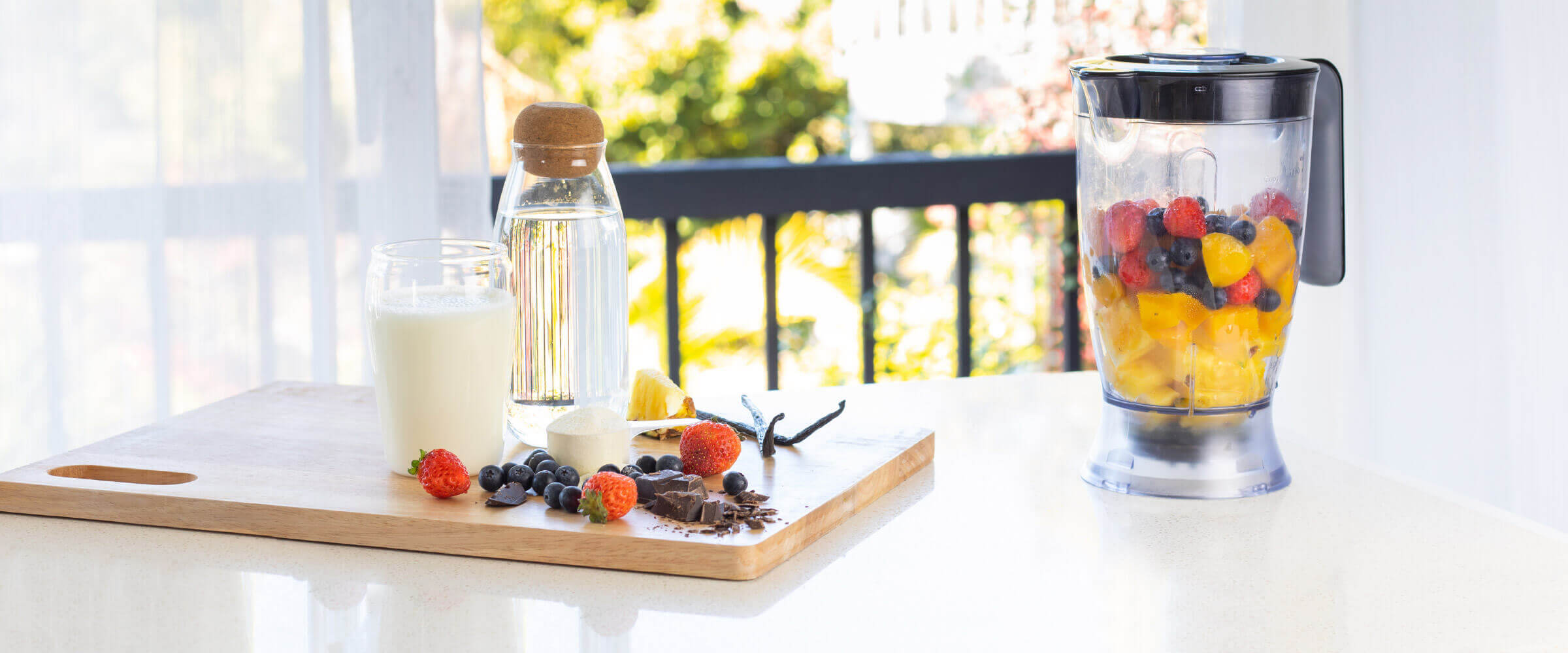 Kitchen table smoothie ingredients and mixer